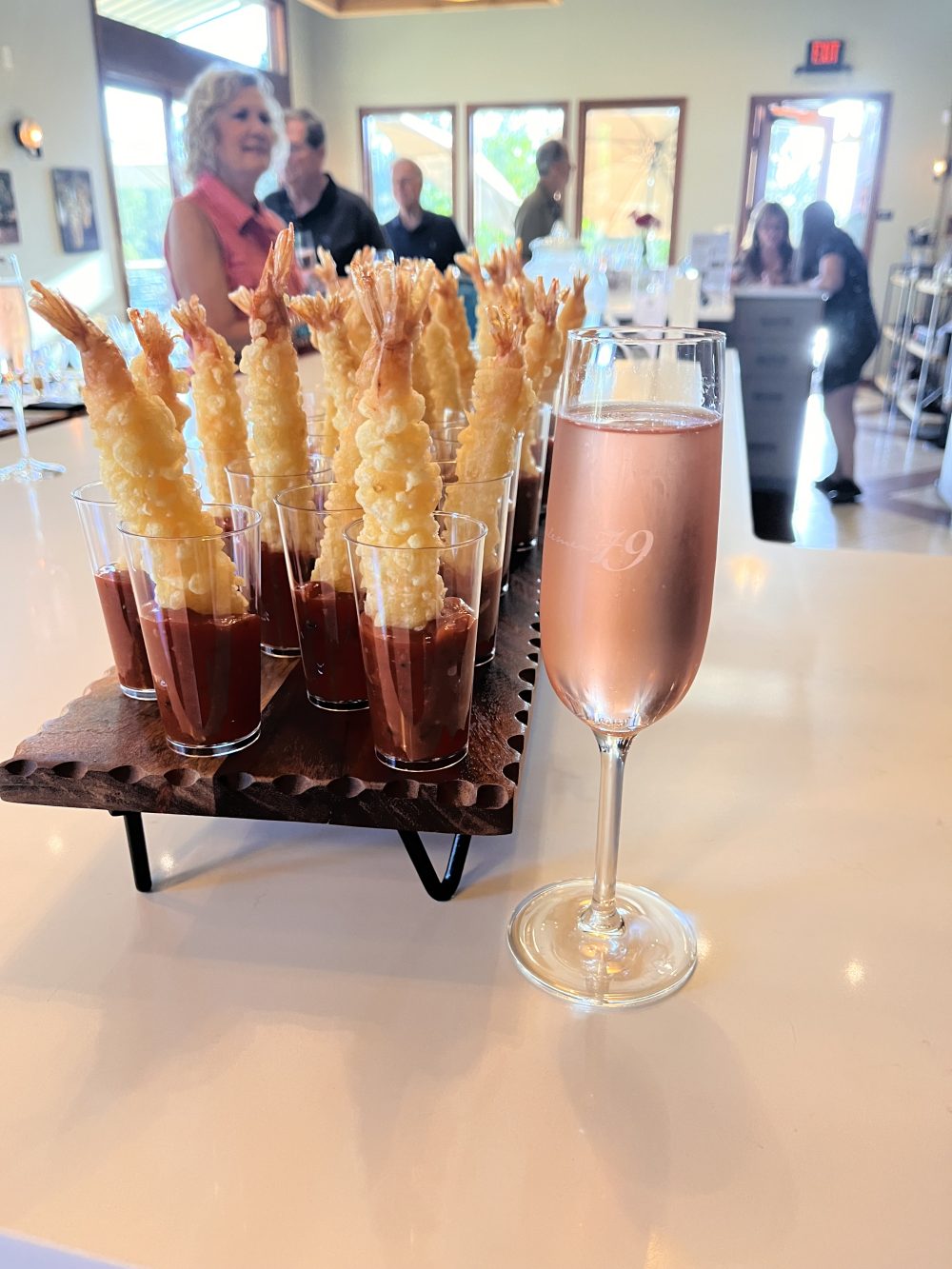 Glass of sparkling rose and shrimp tempura tapas