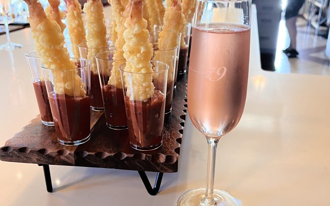 Glass of sparkling rose and shrimp tempura tapas